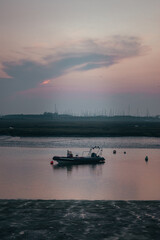 sunset over the sea with boat