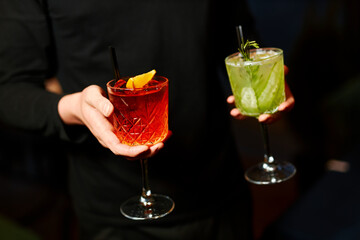 summer red and green lemonade - sangria and mojito on black background