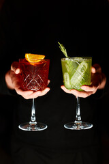 summer red and green lemonade - sangria and mojito on black background