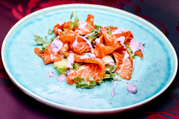 sashimi salmon on a blue plate with steam