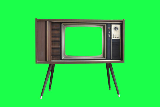 Vintage television with with green screen isolated on green background with clipping path.