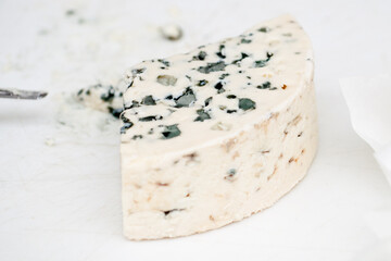 handling a very tasty piece of blue cheese