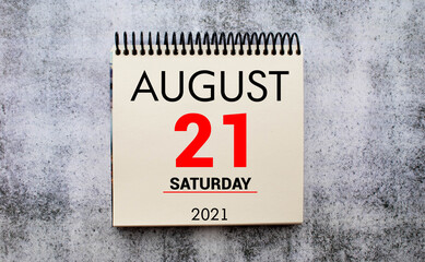 Concept image of August 21 Calendar Day with empty space for text as handwritten note with fountain pen on a notebook.