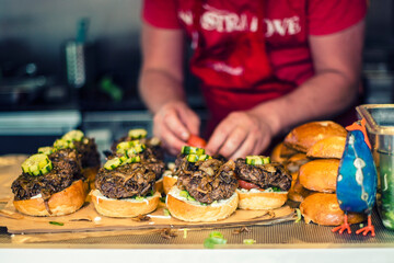 Preparing food-truck hamburgers