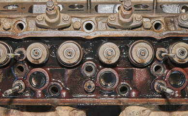 Obraz na płótnie Canvas Top View Intake Valve and Exhaust Valve and Fuel Injector on Cylinder Head of Truck Engine