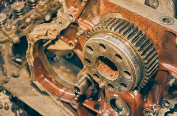 Right Frame High Angle View of Crankshaft Gear in Front of Truck Car Engine or Auto Engine in Vintage Tone