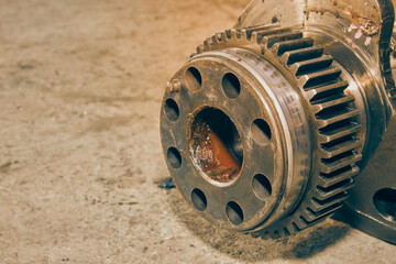 Right Frame Zoom Side View Crankshaft Gear of Truck Engine on Concrete Floor in Vintage Tone