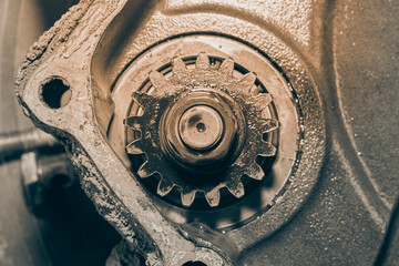 Center Frame Black and White Small Nut and Gear on Crankshaft Cover of Truck Engine