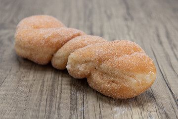 Sugar twist donut is textured with sugar coating for a sweet treat delight