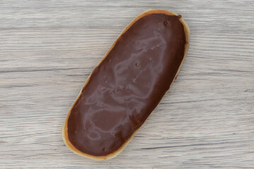 Overhead view of chocolate bar donut is textured with glazed coating for a sweet treat delight
