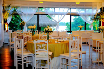 restaurant interior with white tables and chairs
