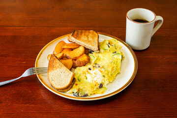 Omelette with toast and potatoes