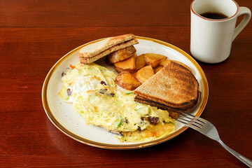 Omelette with toast and potatoes