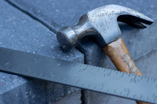 Hammer and metal square ruler.