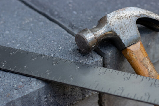 Hammer and metal square ruler