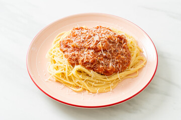 pork bolognese spaghetti with parmesan cheese