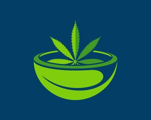 Leaf mortar and pestle with green cannabis leaf inside