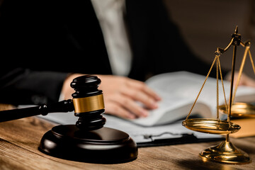 Law firm office, Selective focus judges gavel, businesswoman or female lawyer making contract paper with law book,.scales of justice, document legal, justice advice service concept.