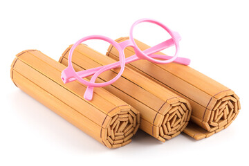 Bamboo slips and glasses frame on white background