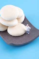 Plate of cookies and chef standing inside