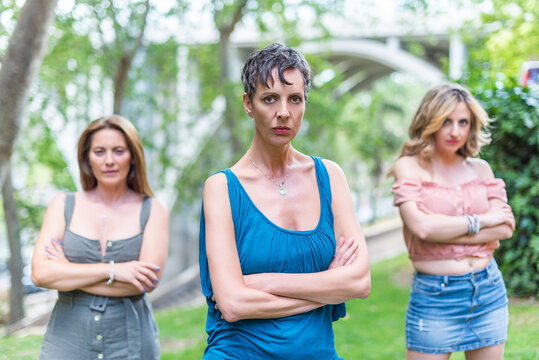 Three Serious Middle Aged Women Looking At Camera With Their Arms Crossed