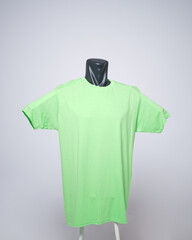 Neon or green color blank men's t-shirt template, front view, natural shape on invisible black mannequin, for your mockup design to print, isolated on plain white background. Free space for your ad.