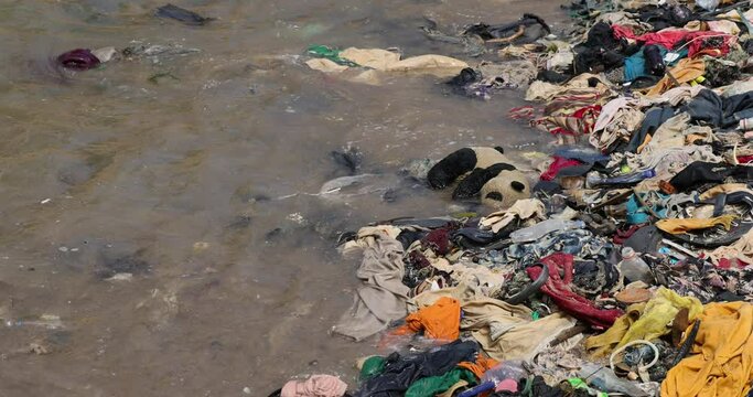 Beach trash Pollution garbage Cape Coast Ghana Africa. Ghana West Africa on the Atlantic ocean. Filthy pollution, trash, garbage and waste wash up on shore. Sandy beaches. Summer vacation destination.
