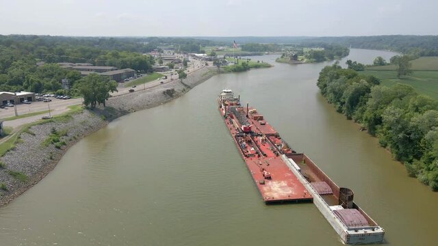Aerial flyover of a barge on the Cumberland River in Clarksville Tennessee