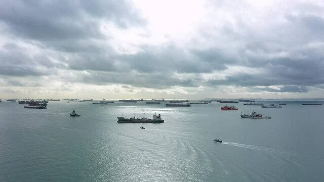 Drone shot of light shining through clouds, Singapore anchorage