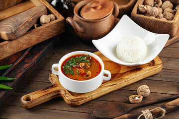 Side view on portion of red mushroom soup