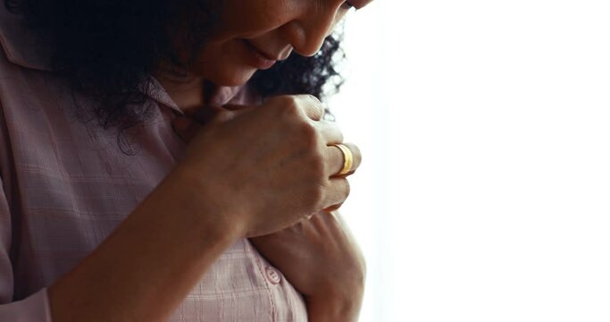 A senior Asian woman feels suffer and pain from headaches using her hand holding head. Concept of older person health care.