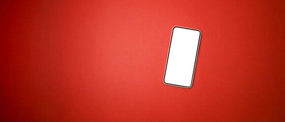 Mock up smart phone with blank screen on red background.