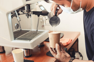 Coffee Latte Barista making pattern in a cup of coffee shop