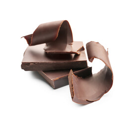 Delicious chocolate curls and pieces on white background