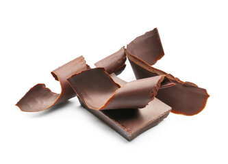 Delicious chocolate curls and piece on white background