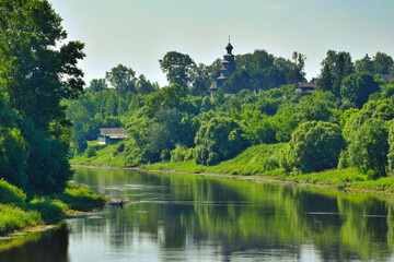 Fototapeta na wymiar Green shores of the Tertsa river in Torzhok