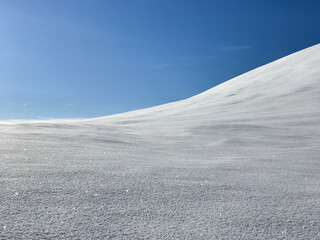 Trolltunga, Norway in April: snowy hills on the sunny day