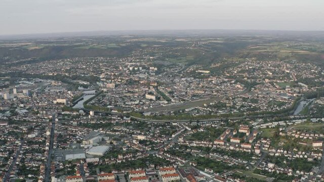 Drone Aerial shot of Montluçon in central France. Montlucon is the largest commune in the Allier department and belongs to the Auvergne-Rhône-Alpes region. A panorama of the french city at sunset.