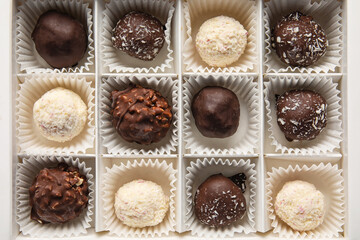 Box with sweet chocolate candies, closeup