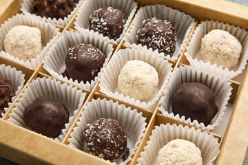 Box with sweet chocolate candies, closeup