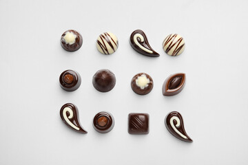 Sweet chocolate candies on light background