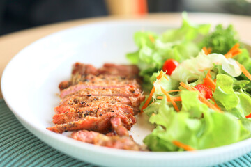  Pork grill and salad vegetables.