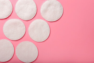 Cotton pads on color background