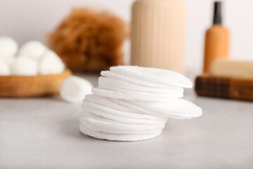 Fototapeta na wymiar Cotton pads on light background, closeup