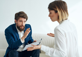male psychologist next to female patients depression communication therapy