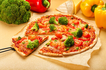 Parchment with tasty vegetarian pizza on color background