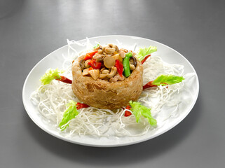 deep fried crispy yam taro ring with stir fried mixed seafood and meat nut in chef oyster sauce asian halal menu