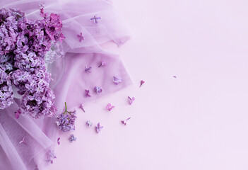 bouquet of lilacs in a vase postcard composition of flowers on a pink background