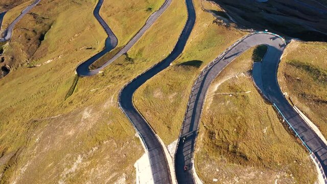 Aerial view of motorcyclists riding Fuscher Torl pass on Grossglockner scenic High Alpine Road, Austria