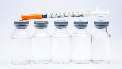 a bottle of vaccine on a white background